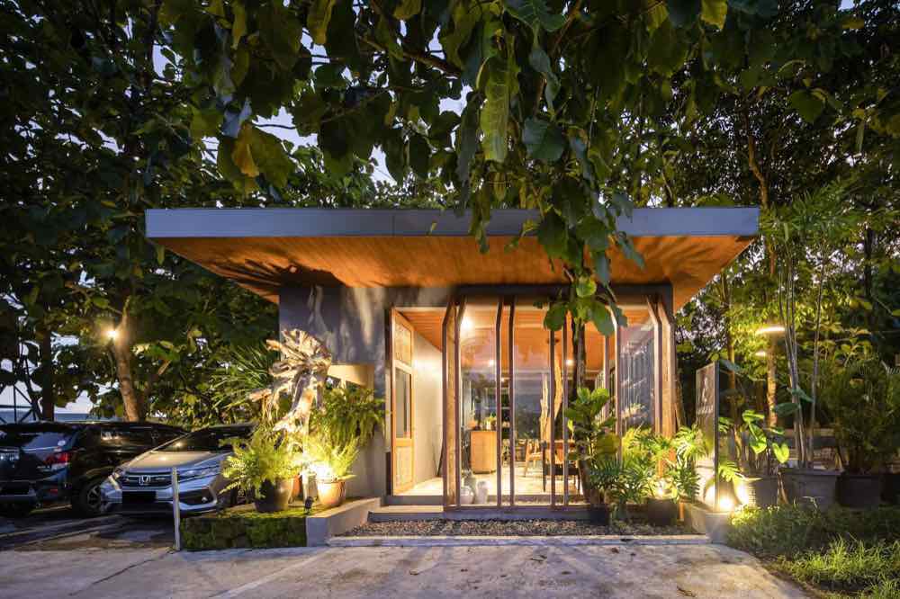 Dapur Guri lit up at night under the trees