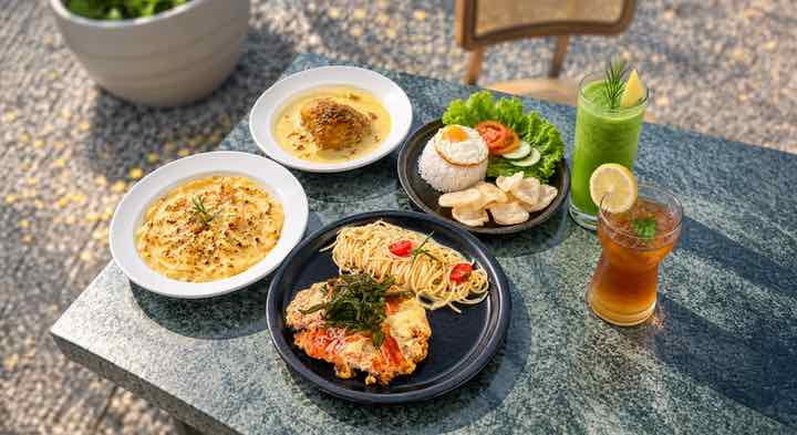 Pasta, a salad bowl and drinks from the Dapur Guri kitchen